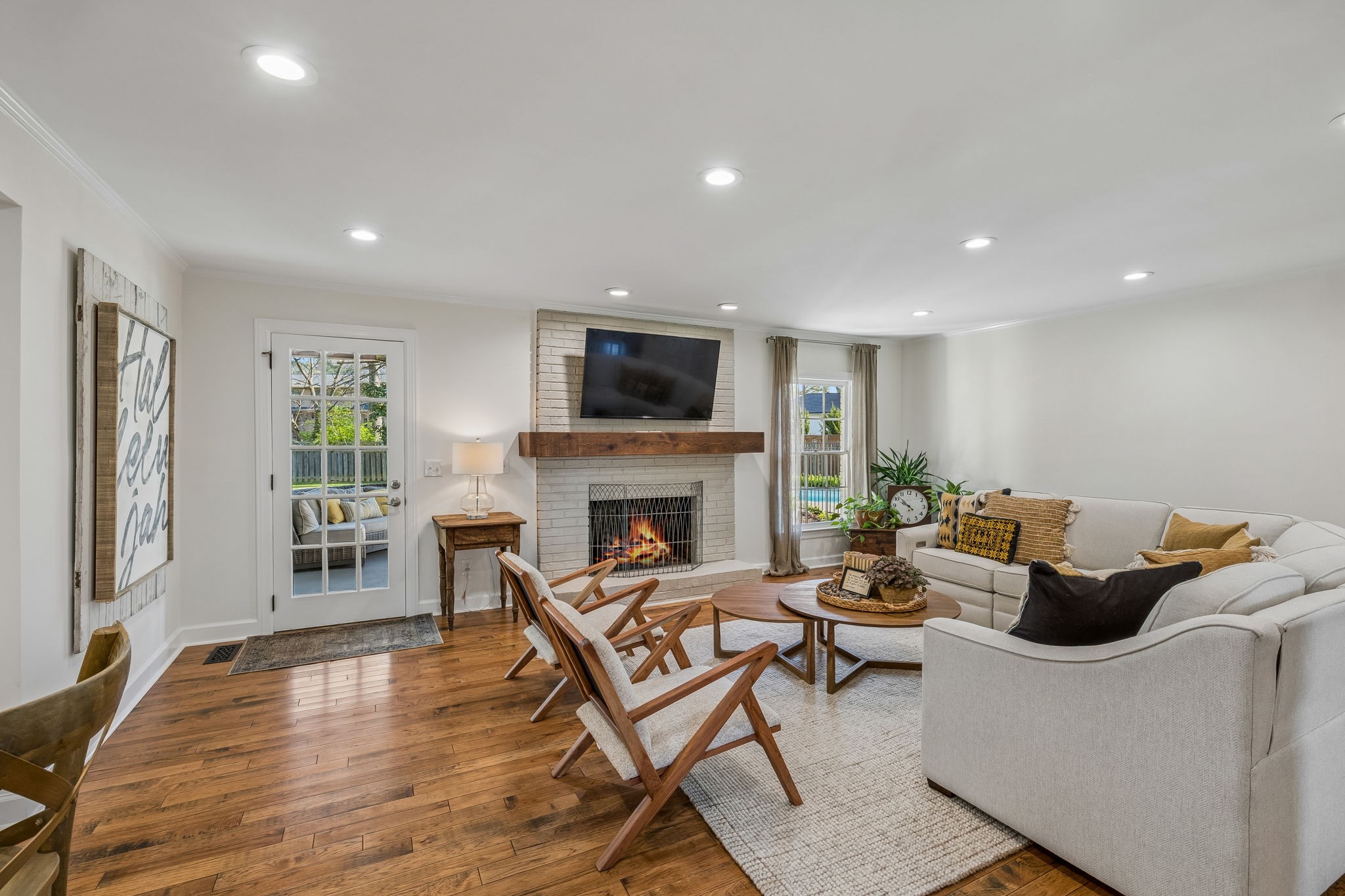 3007 Braintree Road Franklin, TN 37069 - Photo 7 of 71 a living room with furniture a fireplace and a flat screen tv