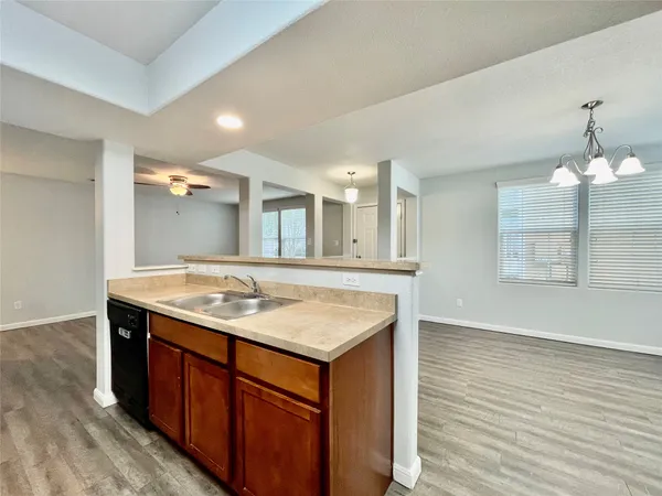 a bathroom with a granite countertop sink a large mirror and vanity