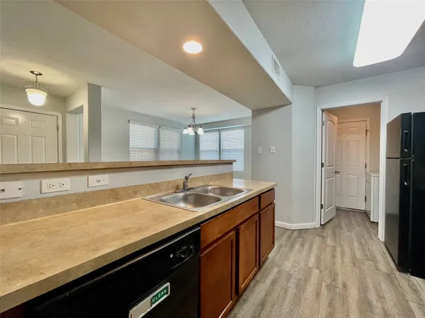 a spacious bathroom with a sink and a mirror