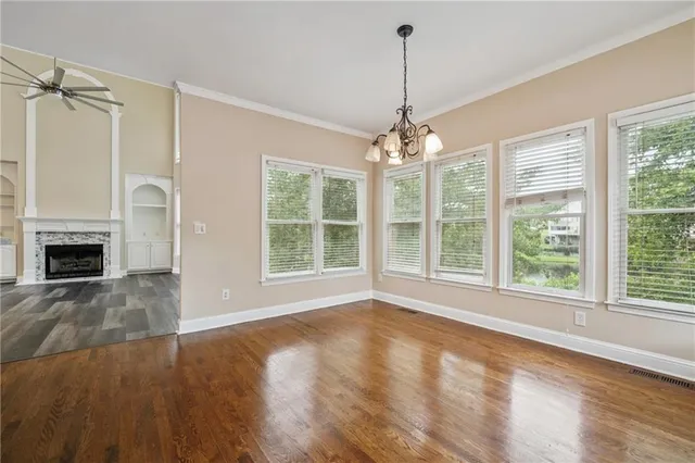 a kitchen with stainless steel appliances granite countertop a stove sink and cabinets