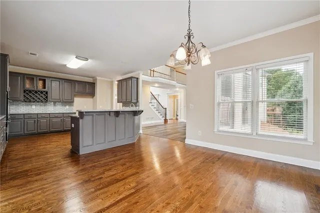a kitchen with stainless steel appliances granite countertop a stove and cabinets