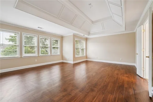 a spacious bathroom with a granite countertop sink mirror and shower