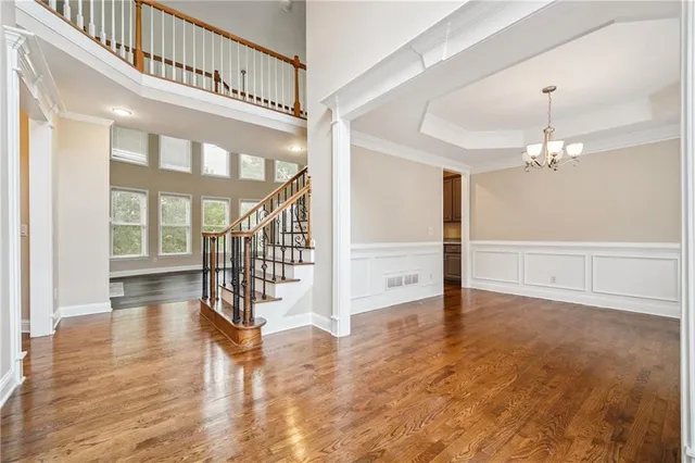a view of an entryway with wooden floor and door