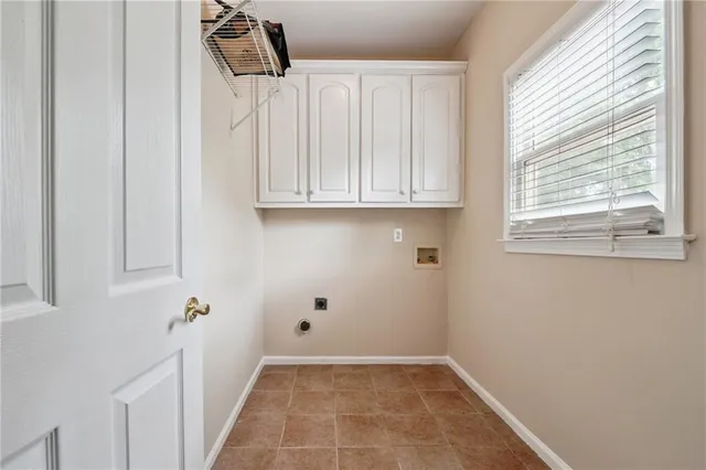 an aerial view of residential houses with outdoor space and lake view