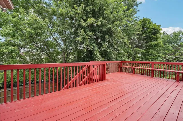 an aerial view of a house with a yard potted plants and large tree
