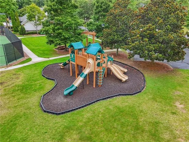 an aerial view of a house having swimming pool patio and lake view