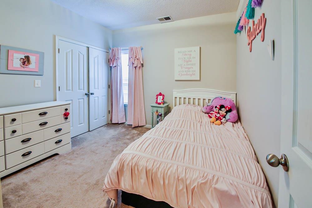 4964 Shaws Ridge Trail Arlington, TN 38002 - Photo 11 of 20 a bedroom with a bed and cabinets