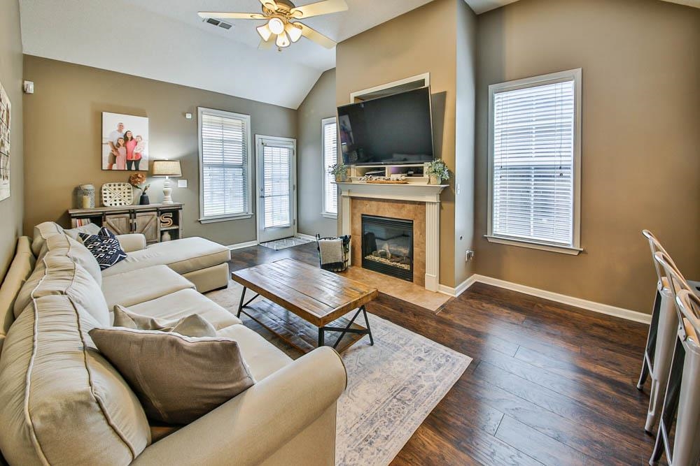 4964 Shaws Ridge Trail Arlington, TN 38002 - Photo 4 of 20 a living room with furniture a flat screen tv and a fireplace
