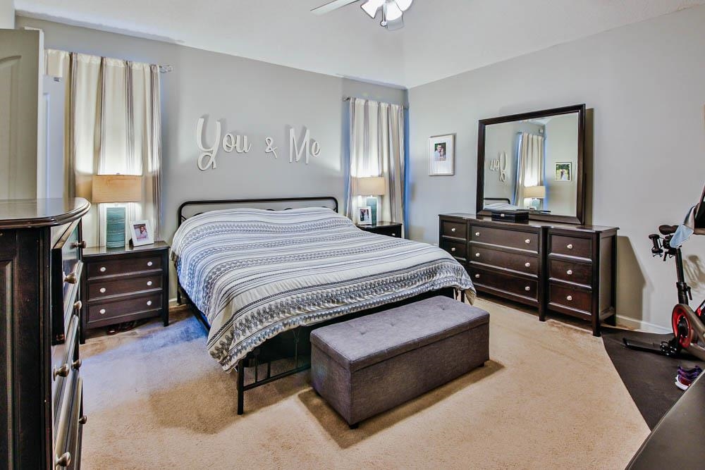 4964 Shaws Ridge Trail Arlington, TN 38002 - Photo 8 of 20 a bedroom with a bed a dresser and painting on the wall