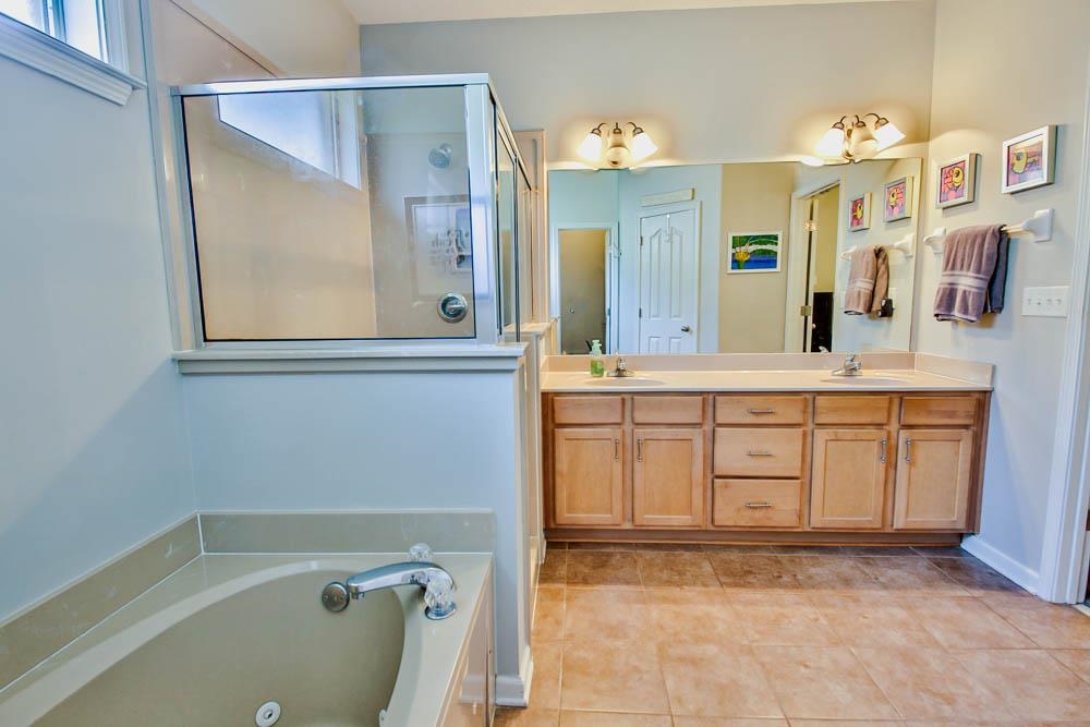 4964 Shaws Ridge Trail Arlington, TN 38002 - Photo 10 of 20 a bathroom with a tub sink and mirror