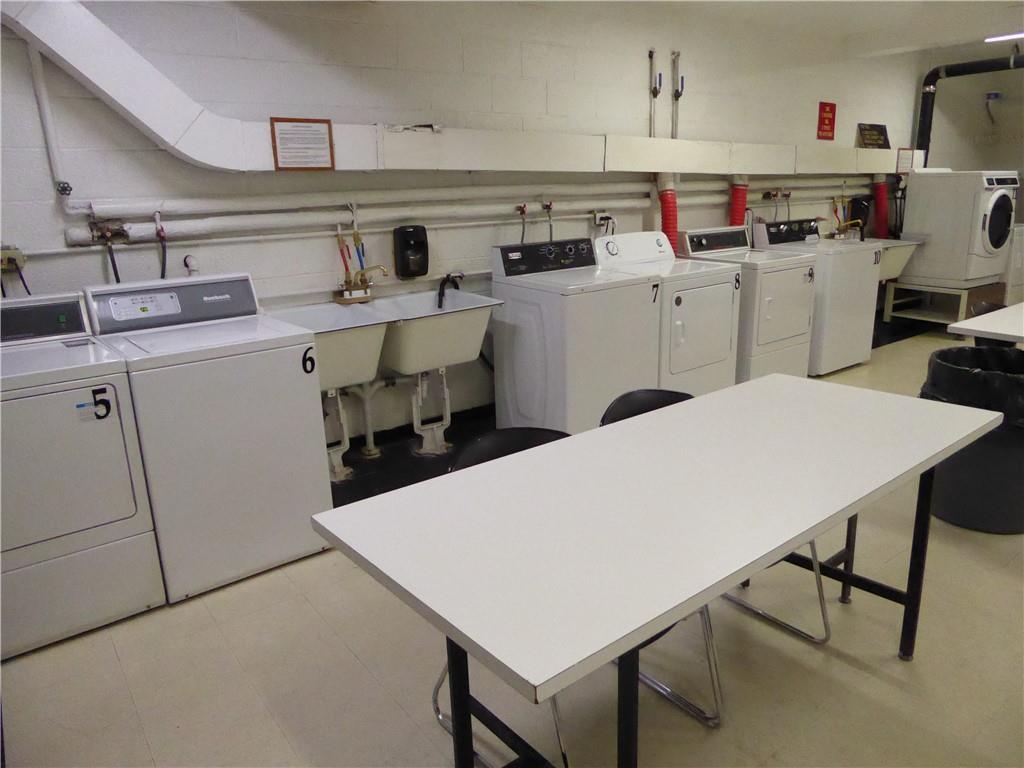 4601 Fifth Avenue, Unit 623 Pittsburgh, PA 15213 - Photo 18 of 24 a utility room with cabinets washer and dryer