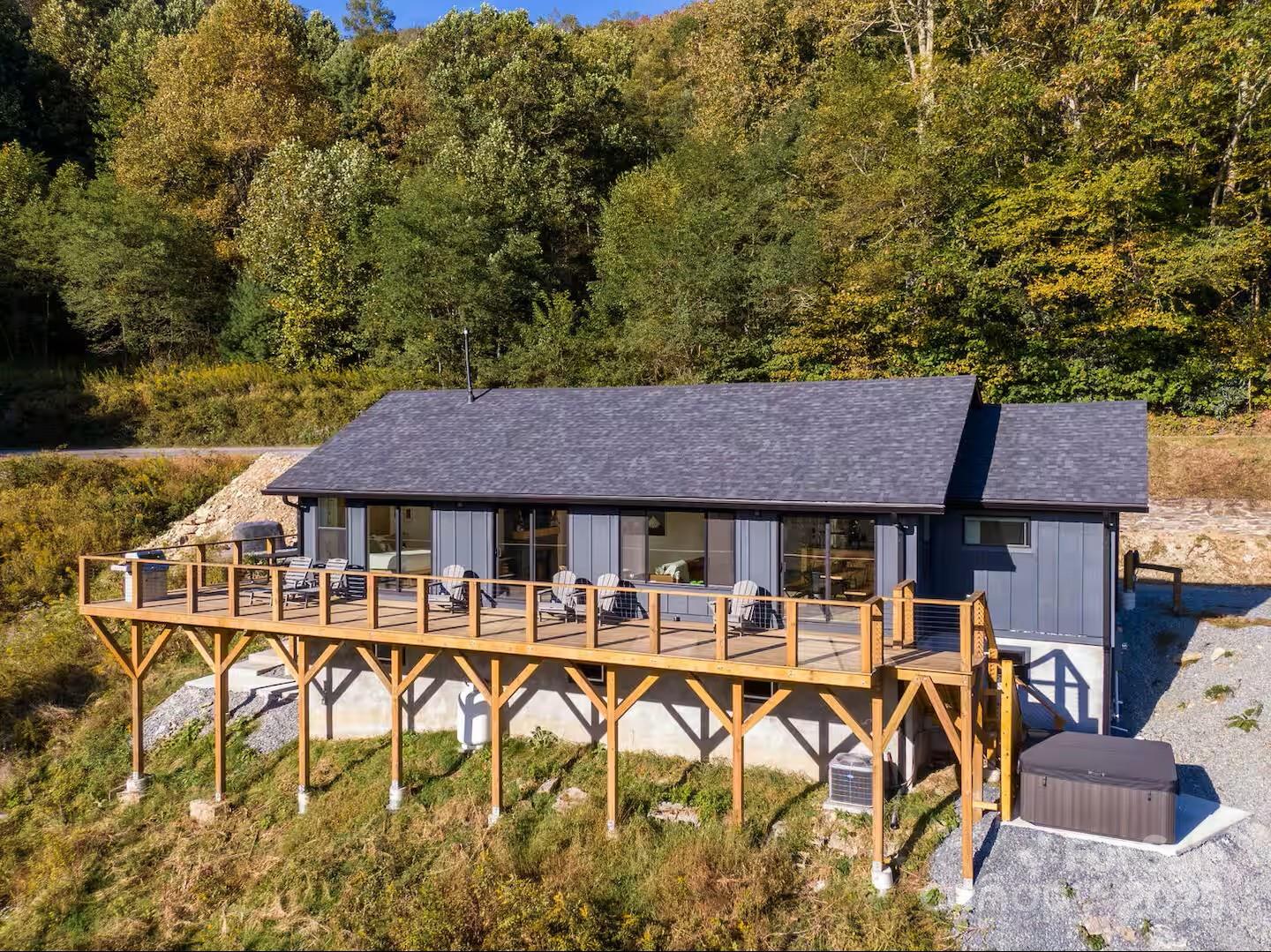 a view of a patio with table and chairs and a barbeque