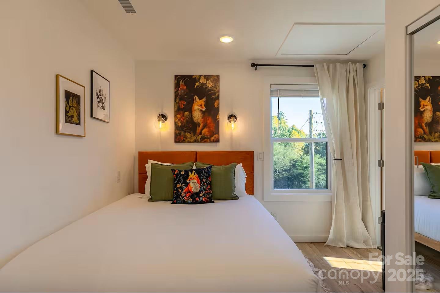 4612 Shulls Mill Road Blowing Rock, NC 28605 - Photo 12 of 35 a bed room with furniture and a window