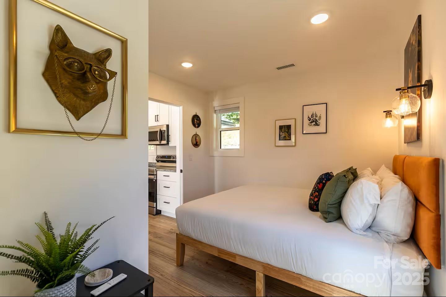 4612 Shulls Mill Road Blowing Rock, NC 28605 - Photo 13 of 35 a bedroom with a bed and a couch