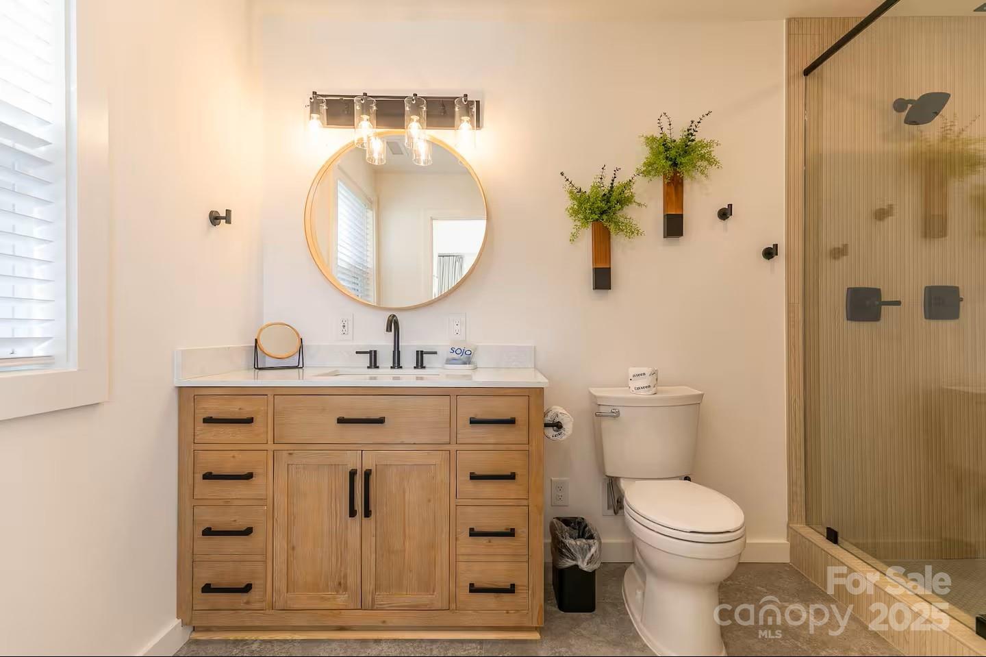 4612 Shulls Mill Road Blowing Rock, NC 28605 - Photo 20 of 35 a bathroom with a toilet a sink and mirror