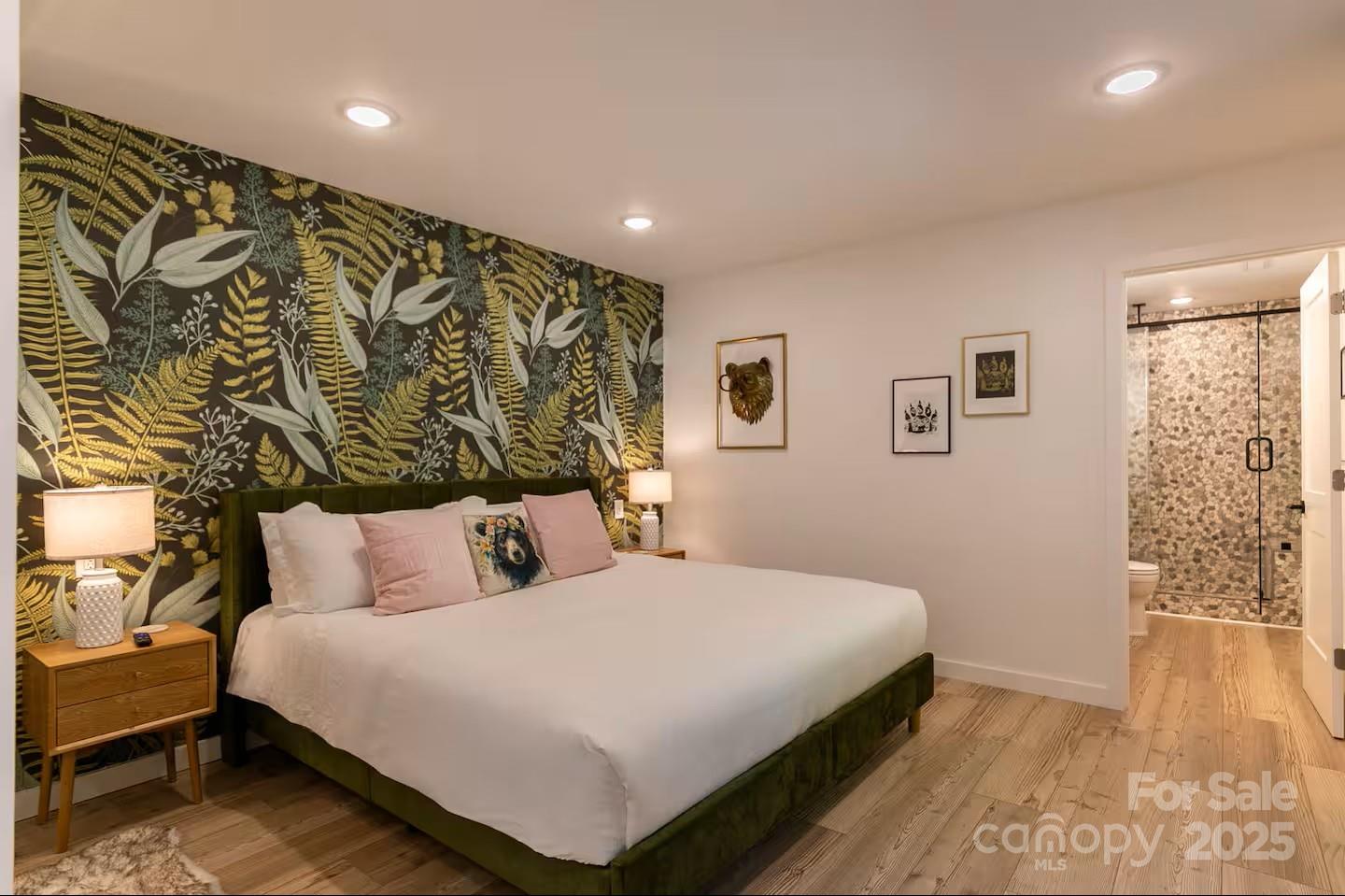 4612 Shulls Mill Road Blowing Rock, NC 28605 - Photo 22 of 35 a bedroom with a large bed and a walk in closet