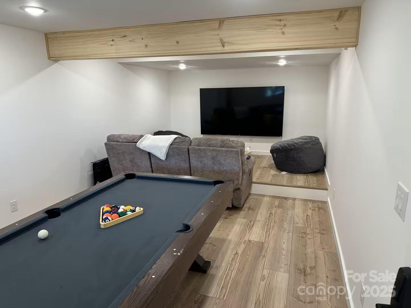 4612 Shulls Mill Road Blowing Rock, NC 28605 - Photo 26 of 35 a living room with furniture and a flat screen tv