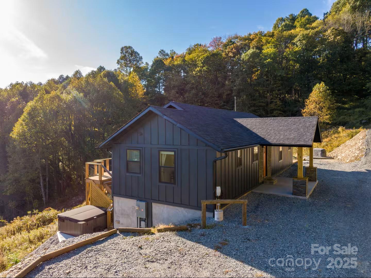 4612 Shulls Mill Road Blowing Rock, NC 28605 - Photo 35 of 35 a backyard of a house with table and chairs