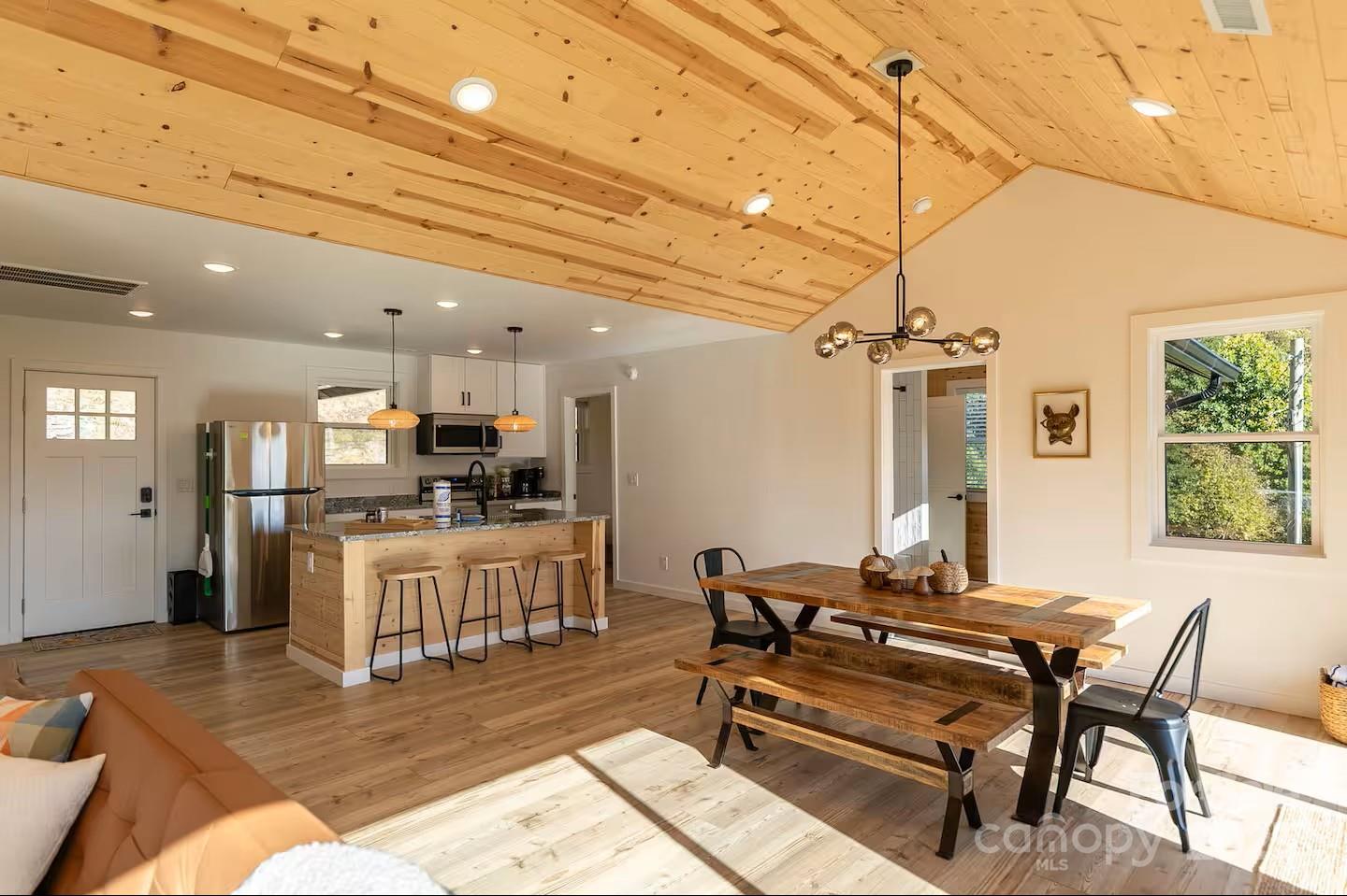 4612 Shulls Mill Road Blowing Rock, NC 28605 - Photo 5 of 35 a living room with furniture kitchen view and a wooden floor