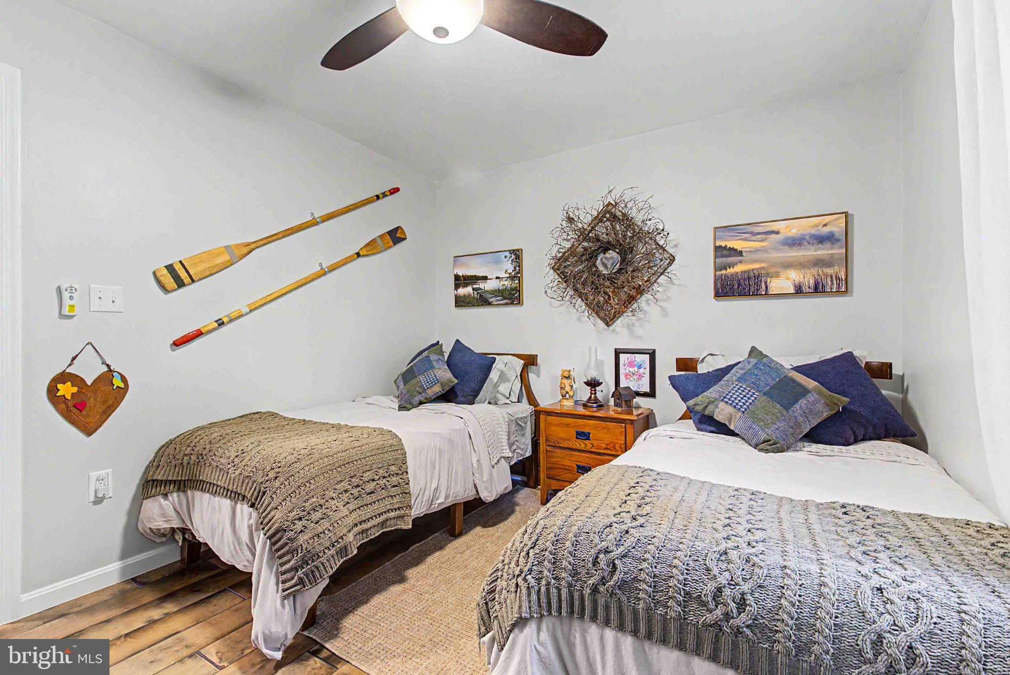 1001 Penn Point Road Oakland, MD 21550 - Photo 40 of 61 Charming twin bedroom with rustic decor.