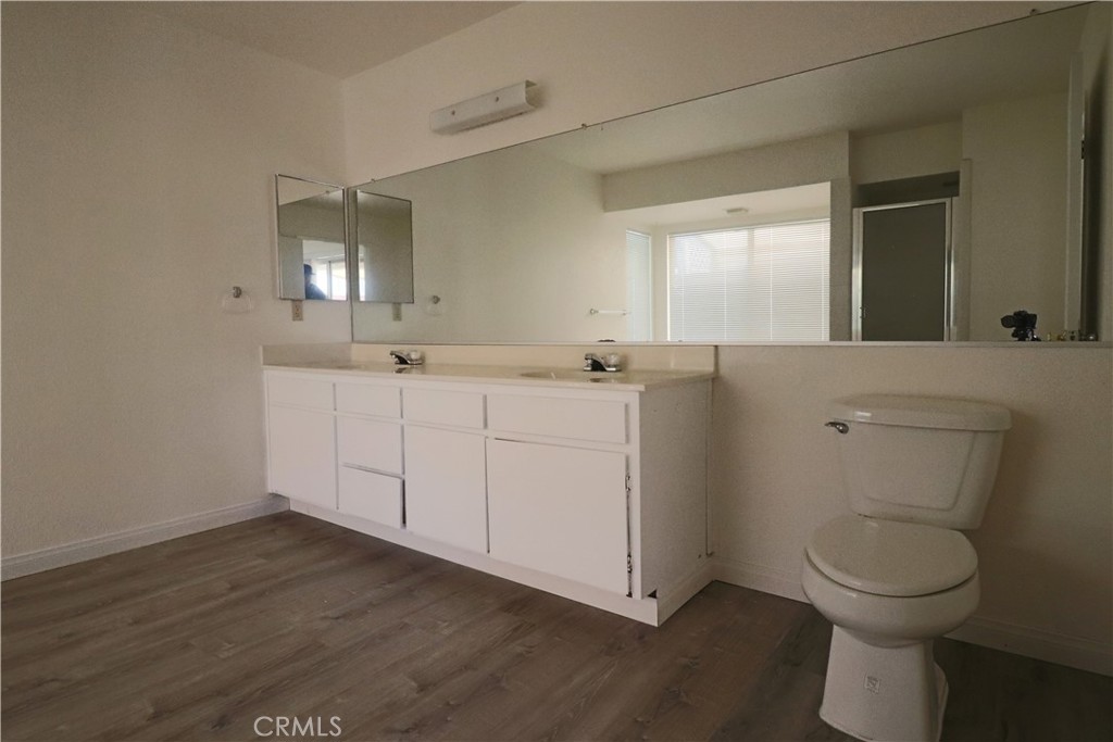 4752 Flying H Road Twentynine Palms, CA 92277 - Photo 39 of 55 a view of bathroom with a toilet sink and mirror