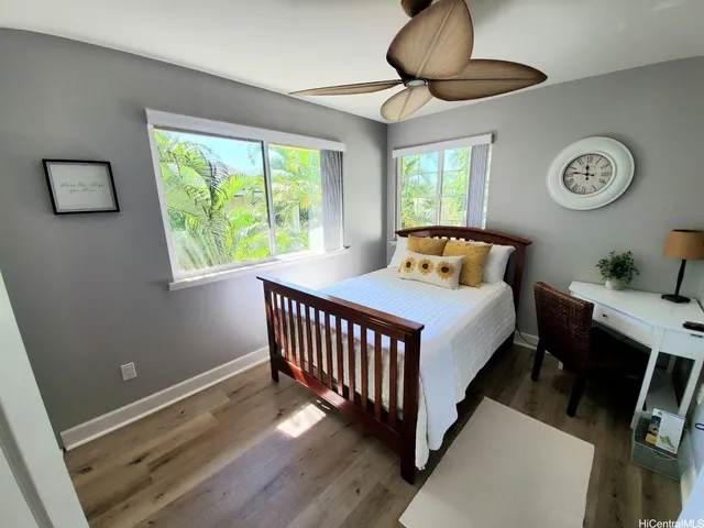 a bedroom with bed and a window