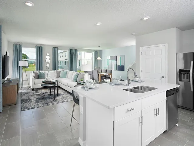 a view of kitchen island a sink and living room