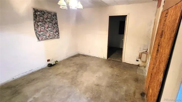 an empty room with windows and entrance