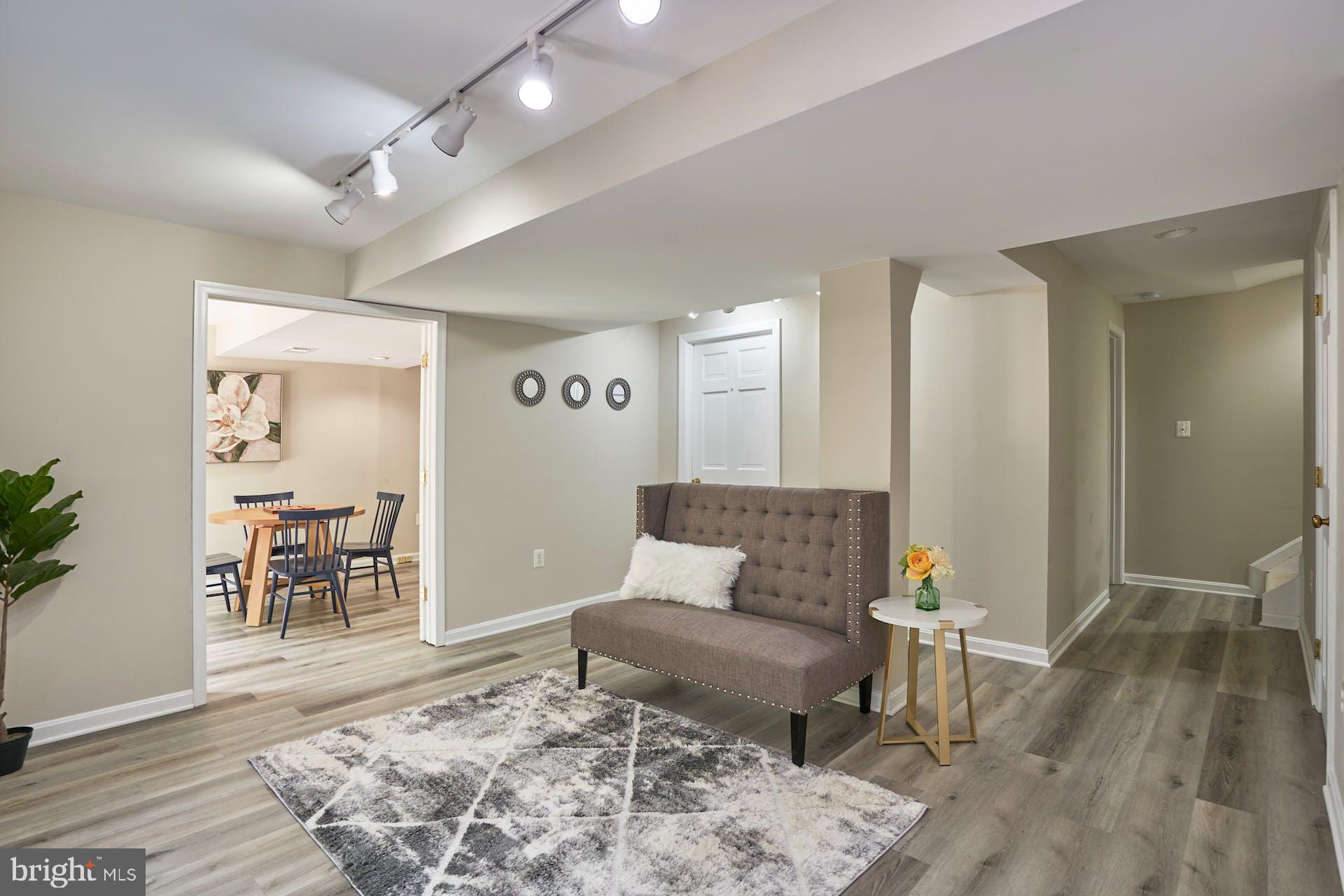 7430 Ridge Road Springfield, VA 22153 - Photo 29 of 49 Rec Room with tract lighting and new LVP floors