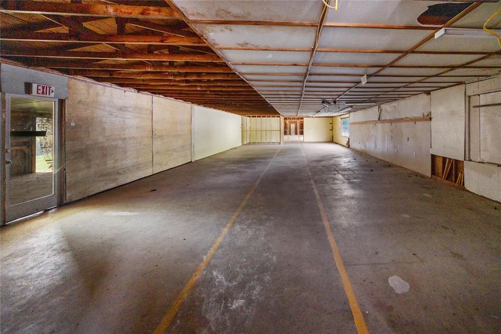 24 Flea Market Road Jasper, GA 30143 - Photo 5 of 6 a view of empty room with wooden ceiling