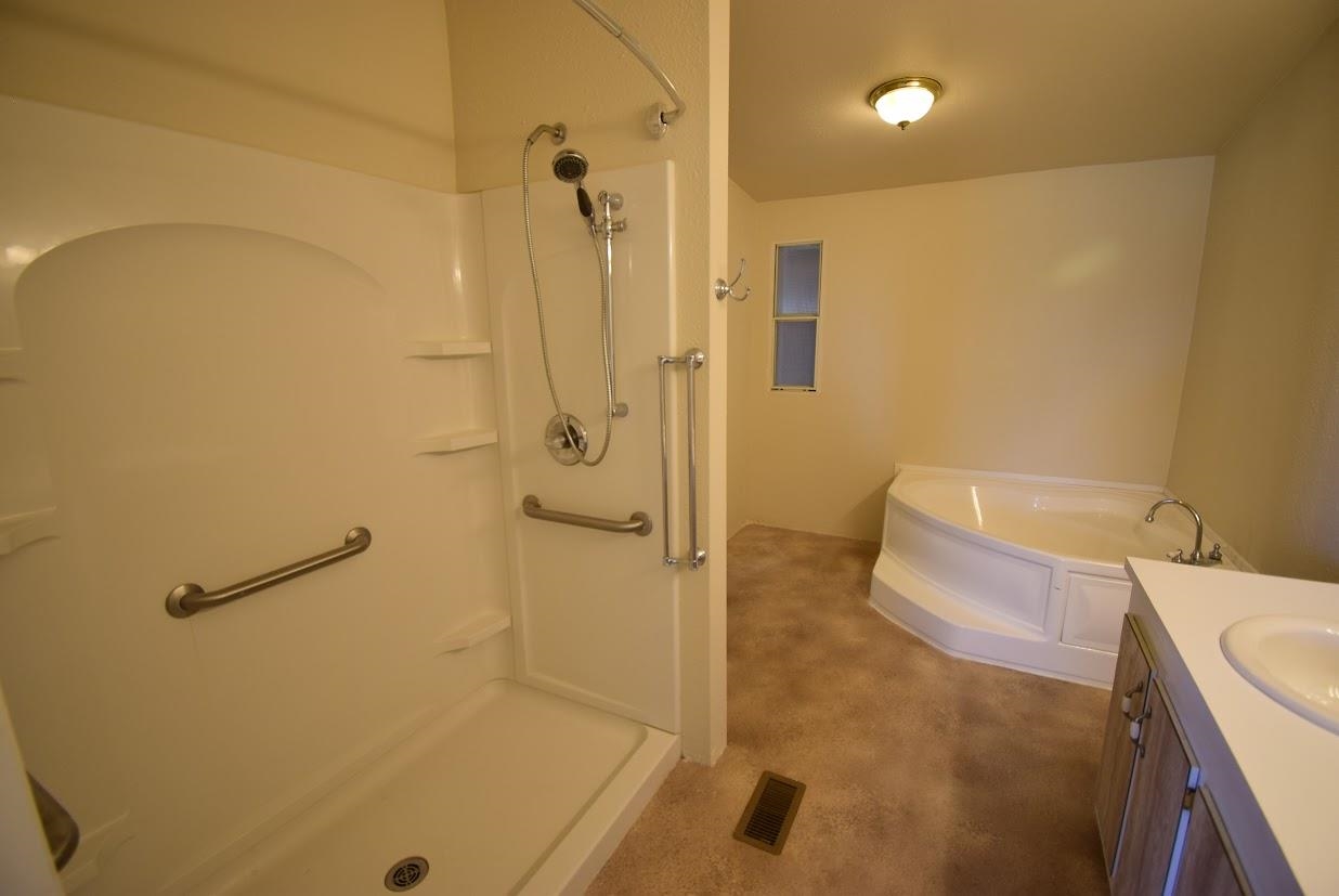 19548 B50 Road Delta, CO 81416 - Photo 15 of 37 a bathroom with a tub and a shower