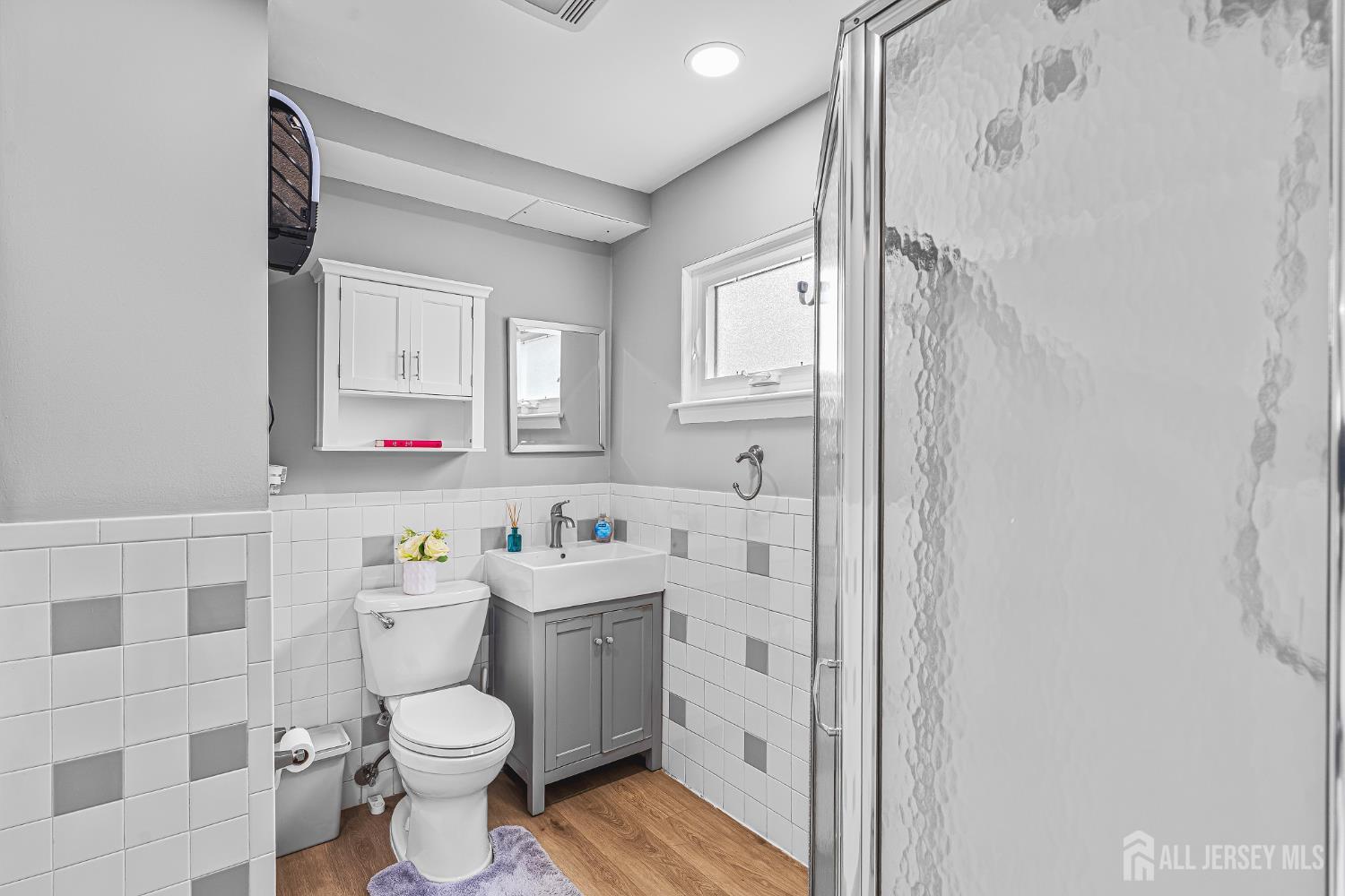 23 Carmello Drive Edison, NJ 08817 - Photo 15 of 28 a bathroom with a toilet sink vanity and shower