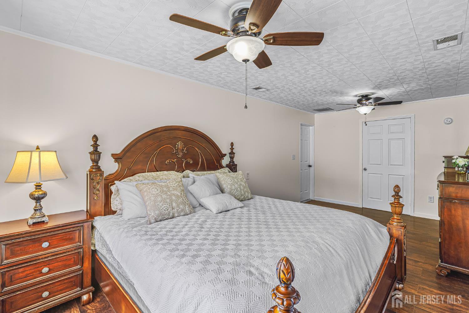 23 Carmello Drive Edison, NJ 08817 - Photo 16 of 28 a bedroom with a bed and a chandelier