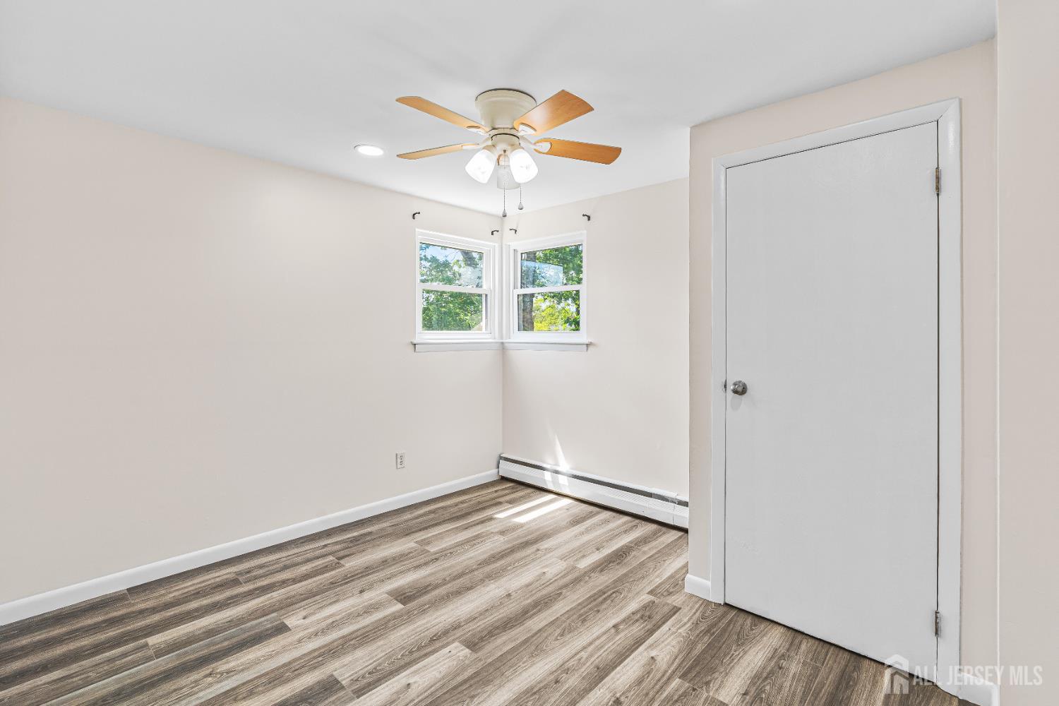 23 Carmello Drive Edison, NJ 08817 - Photo 22 of 28 wooden floor in an empty room with a window