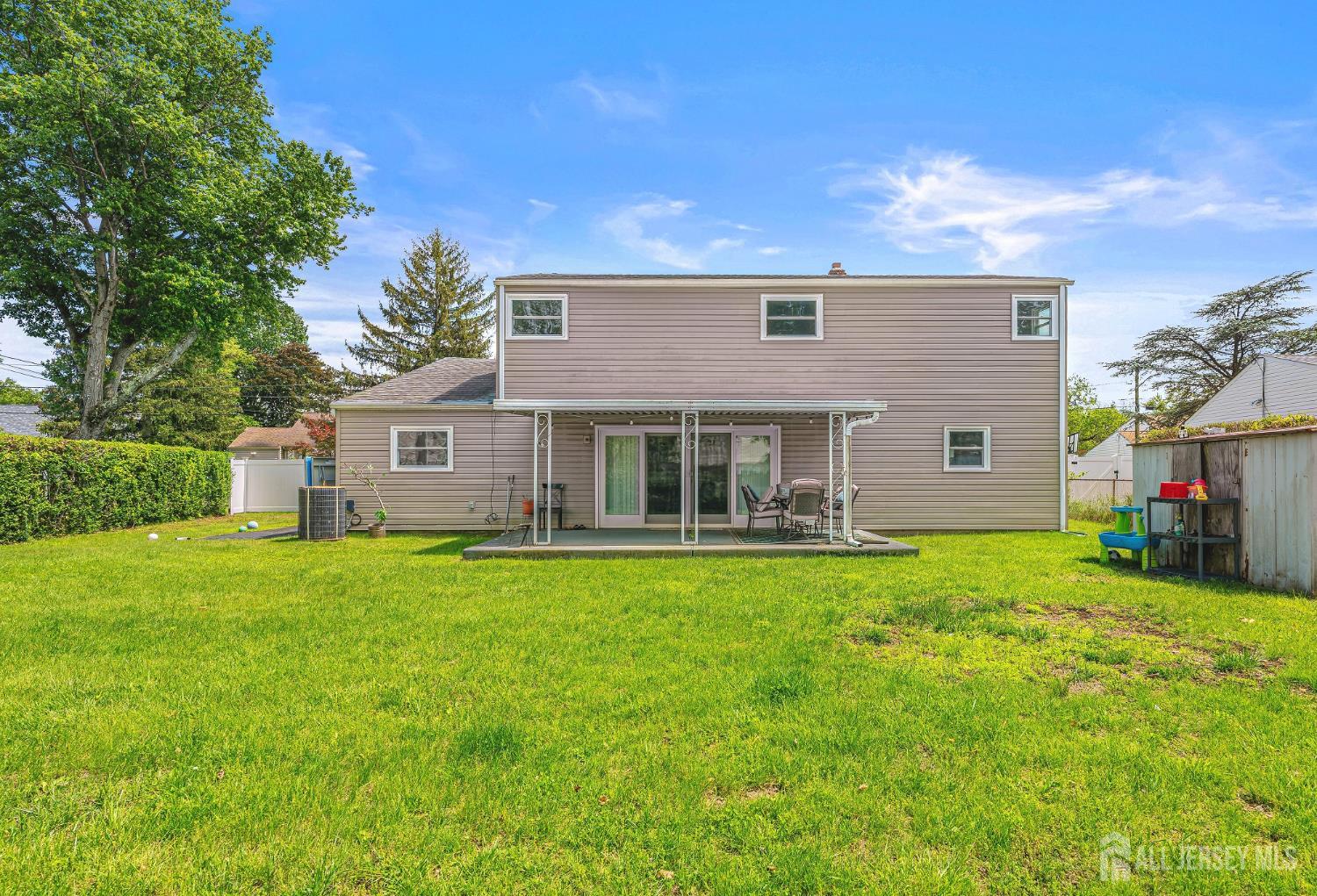 23 Carmello Drive Edison, NJ 08817 - Photo 24 of 28 a front view of a house with a garden