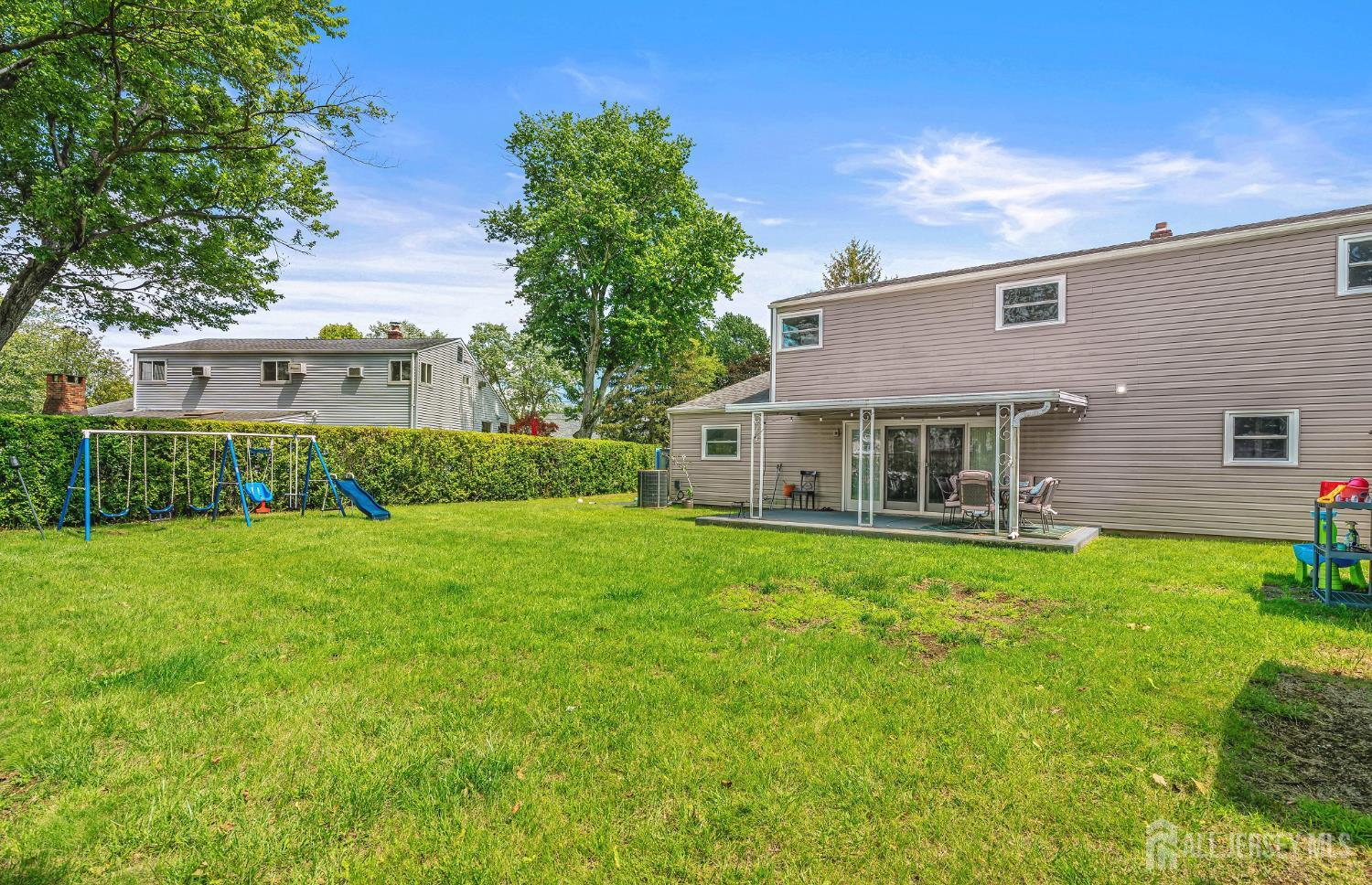 23 Carmello Drive Edison, NJ 08817 - Photo 25 of 28 a front view of house with yard and green space