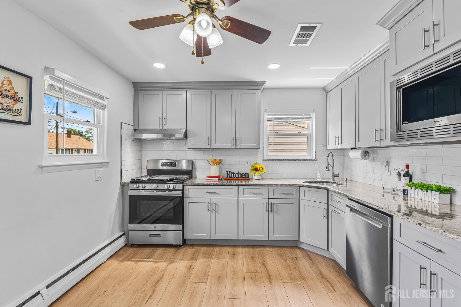 23 Carmello Drive Edison, NJ 08817 - Photo 7 of 28 a kitchen with stainless steel appliances granite countertop a stove cabinets and microwave