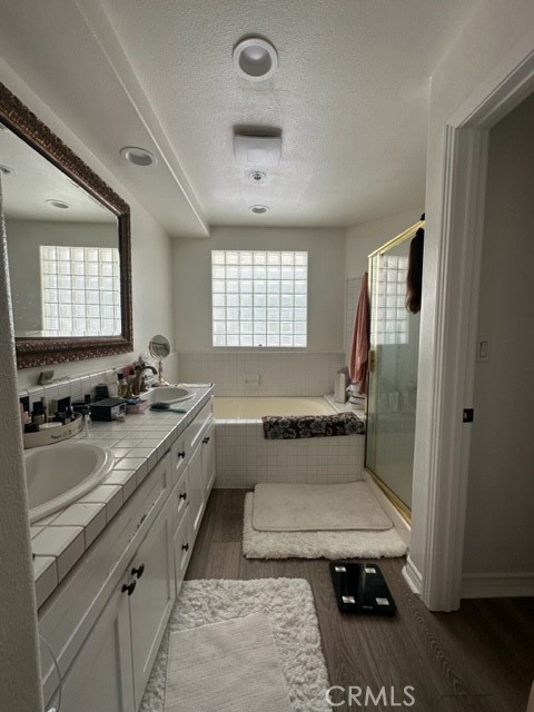 2243 Martin, Unit 409 Irvine, CA 92612 - Photo 11 of 31 a bathroom with a tub sink toilet and window