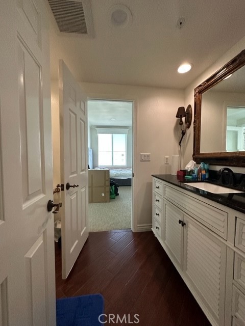 2243 Martin, Unit 409 Irvine, CA 92612 - Photo 12 of 31 a en suite bathroom with a sink and mirror