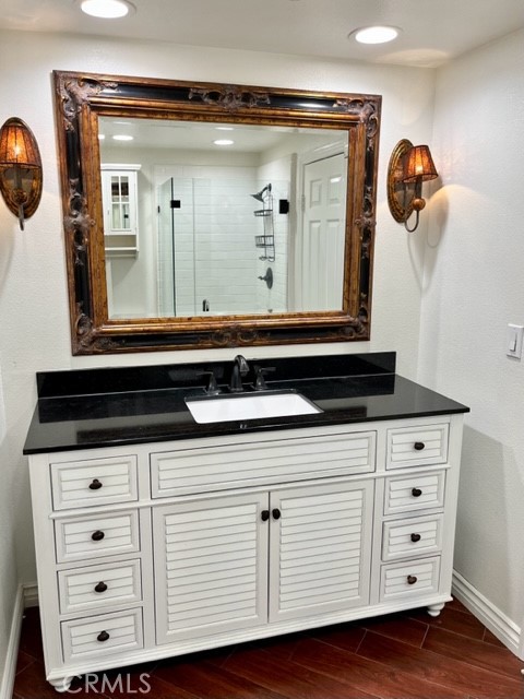 2243 Martin, Unit 409 Irvine, CA 92612 - Photo 16 of 31 a close view of a dresser a mirror and cabinets