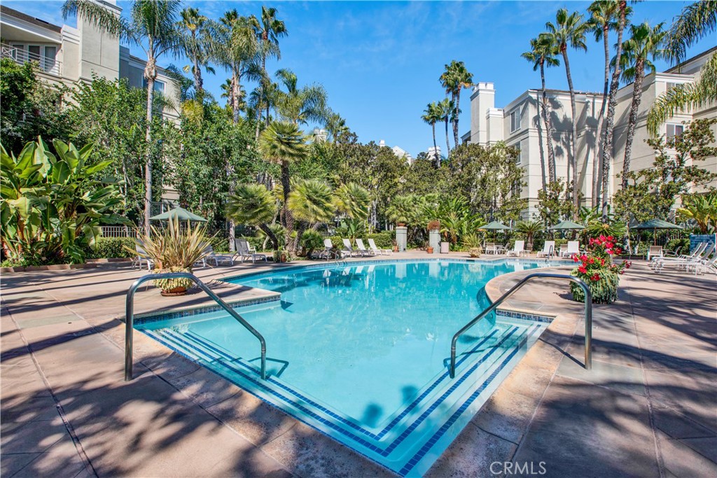 2243 Martin, Unit 409 Irvine, CA 92612 - Photo 24 of 31 a view of a tennis ground with large trees