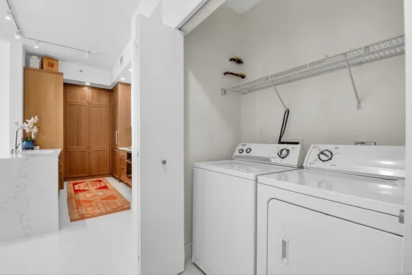 a room with furniture and potted plant