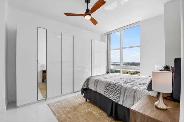 a kitchen with kitchen island a counter top space a sink stainless steel appliances and cabinets