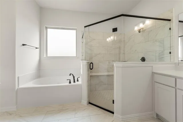 a bathroom with a bathtub and a sink