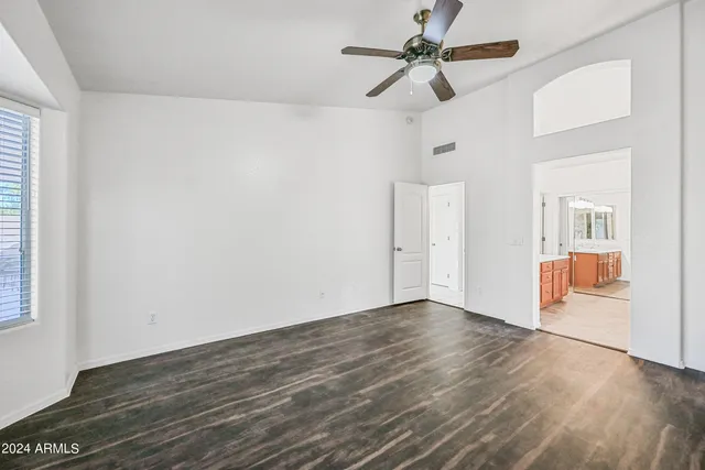 a spacious bathroom with a double vanity sink mirror and double