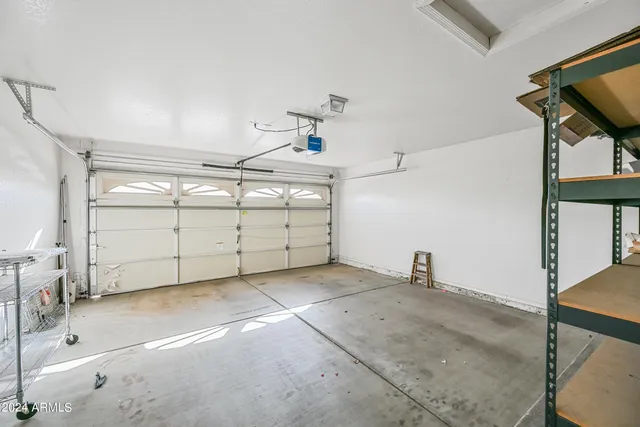 a balcony view with a large window and wooden floor