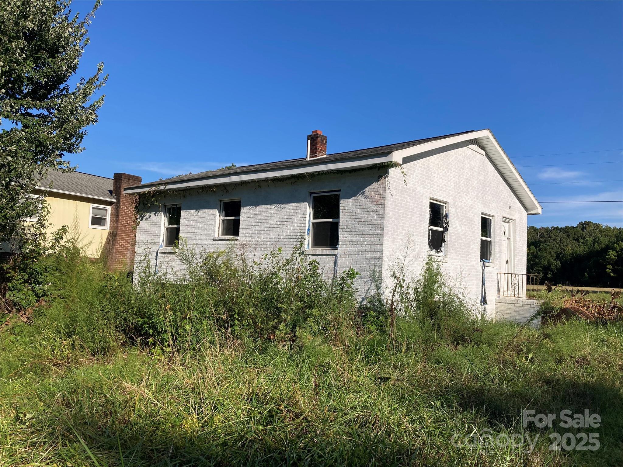 6230 Old Mocksville Road Salisbury, NC 28144 - Photo 2 of 8 a view of a house with backyard