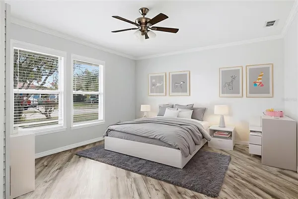 a spacious bedroom with a bed and a large window