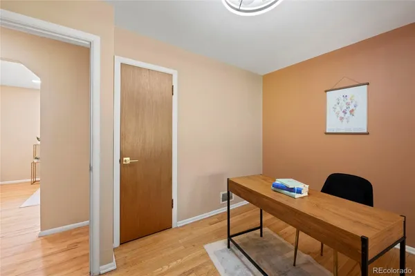 a reading room with furniture and wooden floor