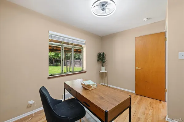 a view of a room that has a table and chairs in it
